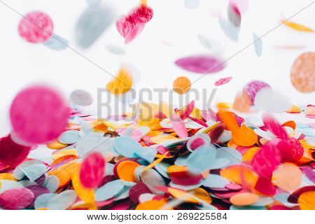 Multicolored Round Confetti Is Flying To The Table. Festive Concept. Selective Focus