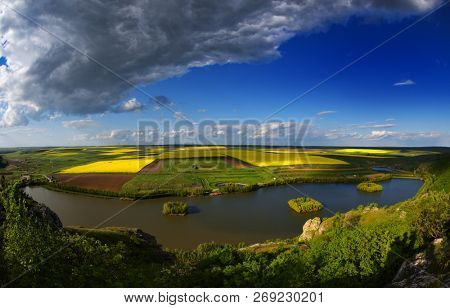 panoramic view of fields in spring and cloudy sky, Dobrogea, Romania