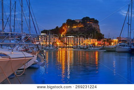 Denia sunset with castle and marina at Alicante in Spain