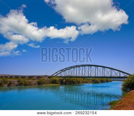 Xuquer Jucar river metal bridge in Fortaleny of Valencia at Spain