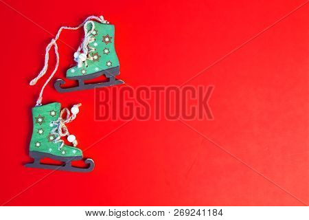Christams Time Decoration, Card And Wood Figure Skates On Red Backround. New Yaer