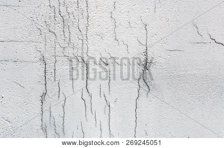Texture Of White Dirty Cracked Wall. Small Straight Cracks. Direct Fracture On Painted Surface. Cell