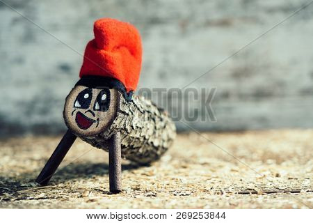 a handmade tio de nadal, a typical christmas character of catalonia, spain, with some blank space on the right