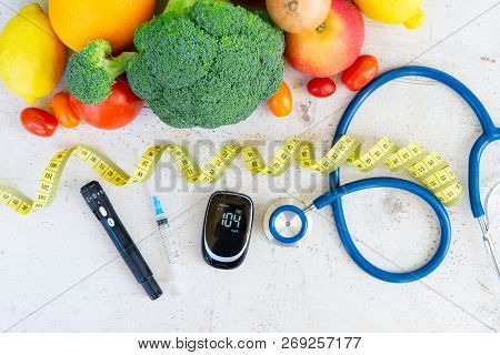 Raw Vegetables With Blood Glucose Meter, Syringe, Lancet And Stethoscope On Desk, Diabetes Healthy D