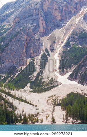 Mudflow With Snow High In The Alpine Mountains Lake, Lago Di Braies
