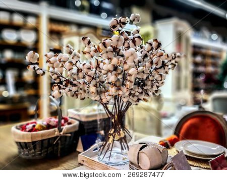 Closeup Of Beautiful Light Christmas Decoration With White And Golden Flowers In The Shop. Backgroun