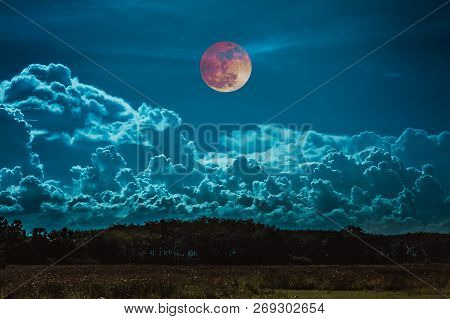 Beautiful Countryside Area At Night. Attractive Red Blood Moon On Dark Sky With Cloudy Above Silhoue