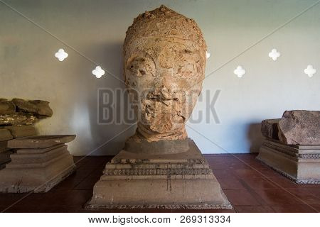 Old Buddha Statue In Pha That Luang, Gold-covered Large Buddhist Stupa In The Centre Of The City Of 