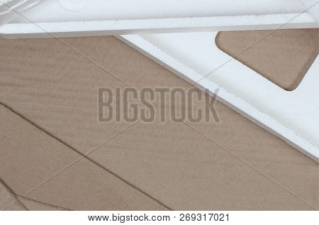 Background Image With Beige Cardboard Paper And Styrofoam Boxes Disgarded As Rubbish. The Concept Of