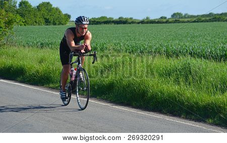 Grafham, Cambridgeshire, England - May 21, 2017:    Close Up Of Male Triathlete  Competitor On Road 