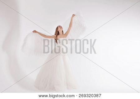 Girl In White Dress With Angel Wings On White Background. Angel-woman
