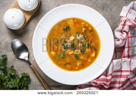 Traditional Hungarian Goulash Soup On The Stone Table. European Cuisine. Top View,