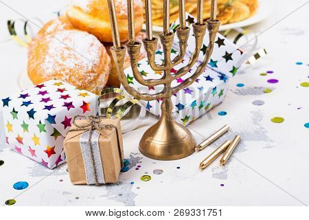 Jewish Holiday Hanukkah Background. Traditional Dishes - Sweet Doughnuts And Potato Latkes. Hanukkah