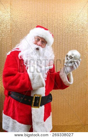 Santa Claus. Santa Claus holds a Human Skull. Santa finds an old Elf Skull. Old Man Winter is scared. Sold my soul to Santa. 