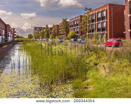 Ecological Street With Middle Class Family Apartments And Natural Eco Friendly River Bank In Wagenin