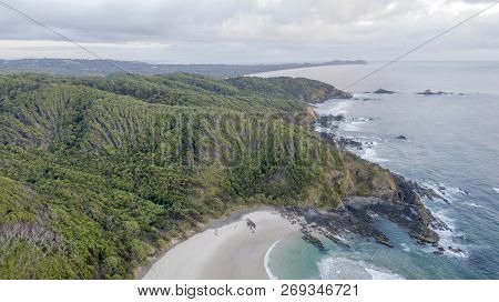 Aerial Photo Of Rocky Hills Covered With Forest And Sea Cliffs Dropping Into The Sea