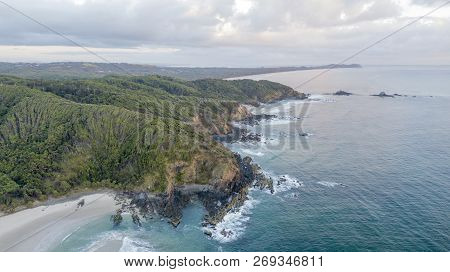 Bay Beach Cliffs And Forest At Sunrise Aerial Photo
