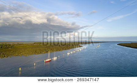 Boats At Ancorage In The River With Sea Entrance  Aerial Photo