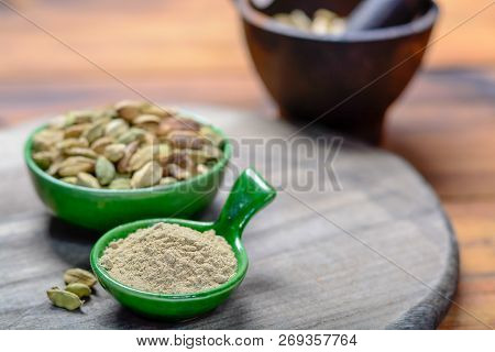 Bowl With Cardamom Pots And Cardamom Powder, Used For Cooking And Traditional Medicine Close Up, Spi