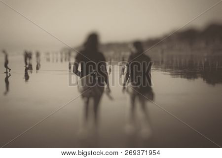 A Blurry Art Image Illustration In Sephia, Black And White Mood. Two Best Friend Women Walking, Talk