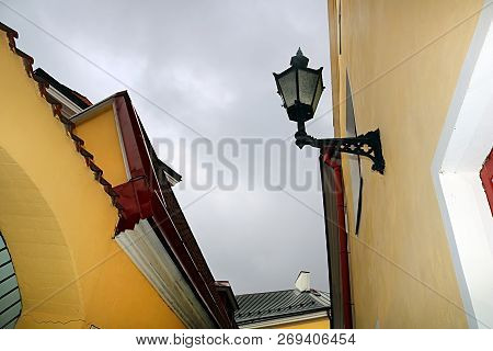 Buildings On Verine Street, Tallinn, Estonia. On A Very Narrow Street, Ladies In Fatin Dresses Could