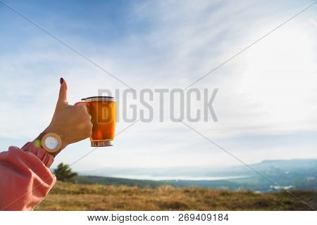Girl Shows Like Holding Thermomug. Outdoors. Hike Mood. Cool Weekend. Active Rest.