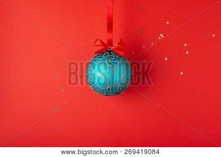 Emerald Christmas Ball With Golden Ornaments Hanging On Red Ribbon. Minimal Styled Holiday Card.