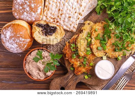 Homemade Traditional Potato Pancakes Or Latke Hanukkah Celebration Food On Vintage Cutting Board. Ru