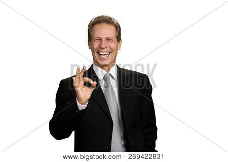 Happy Mature Businessman Showing Ok Sign. Cheerful Male Corporate Gesturing Ok With Fingers, Isolate