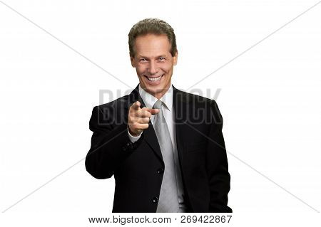 Happy Businessman Indicating With Finger To Camera. Portrait Of Joyful Business Executive Pointing H