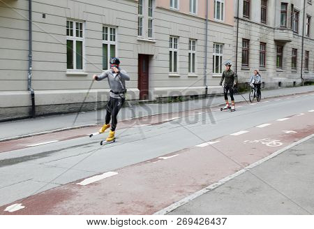 Trondheim, Norway - September 26, 2015: Two Males On Rollerskis Near The University.