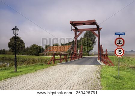 Drawbridge Across The Moat From The Dutch Fortified Town Oudeschans In The Province Groningen