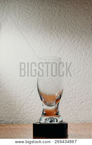 Dirty Glass Of Smusy With The Superheated Grounds On A White Background