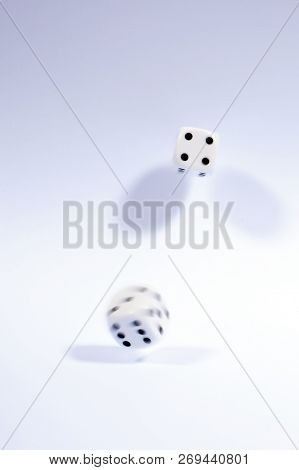 Shot Of Dice Which Have Been Thrown And Randomly Bouncing.