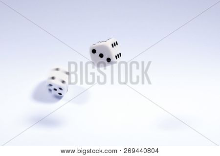 Shot Of Dice Which Have Been Thrown And Randomly Bouncing.