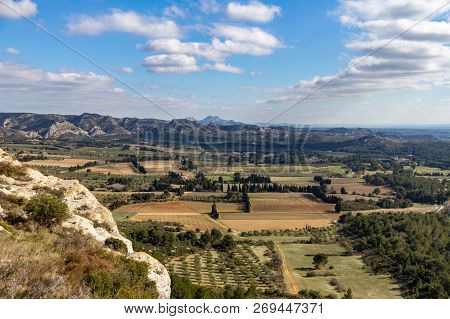 The Valley Between Les Baux De Provence And The Alpilles Mountains Are Dotted With Farms
