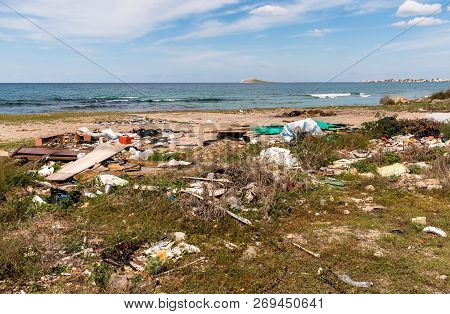 Coastal Degradation With Dirty Beach, Rubbish And Domestic Waste Polluting The Capaci Beach In Provi