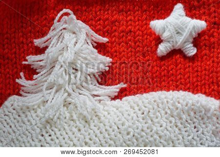 Hadmade Christmas Tree And Star On Red Knitted Woolen Background With Copy Space For Text Christmas 