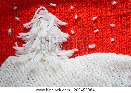 Hadmade Christmas Tree On Red Knitted Woolen Background With Copy Space For Text Christmas Concept