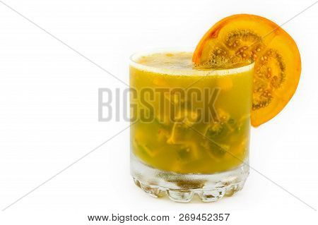 Traditional Colombian Beverage Made Of Juice And Pieces Of Lulo (solanum Quitoense) Called Lulada