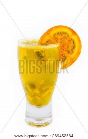 Traditional Colombian Beverage Made Of Juice And Pieces Of Lulo (solanum Quitoense) Called Lulada