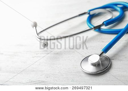 Stethoscope For Checking Pulse On Light Background, Closeup