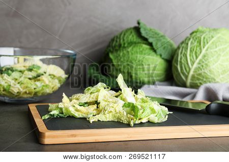 Cutting Board With Chopped Savoy Cabbage On Table
