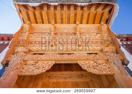 Wood Ornaments Which Decorate Gates Of The Houses In Xiahe Village, Labrang Monastery, Gansu Provinc
