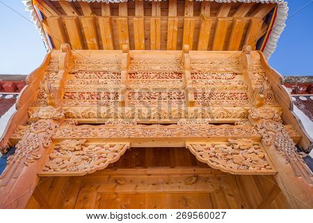 Wood Ornaments Which Decorate Gates Of The Houses In Xiahe Village, Labrang Monastery, Gansu Provinc