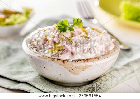 Swabian Sausage Salad - Elsasser Wurstsalat On Wooden Background.