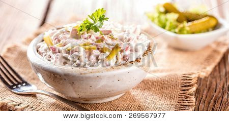 Swabian Sausage Salad - Elsasser Wurstsalat On Wooden Background.