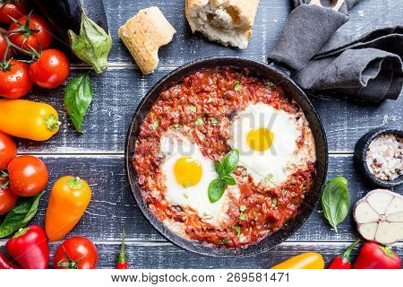Shakshuka, Fried Eggs In Tomato Sauce In Iron Frying Pan. Typical Israel Food. Top View.