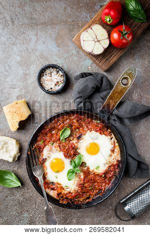 Shakshuka, Fried Eggs In Tomato Sauce In Iron Frying Pan. Typical Israel Food. Top View.