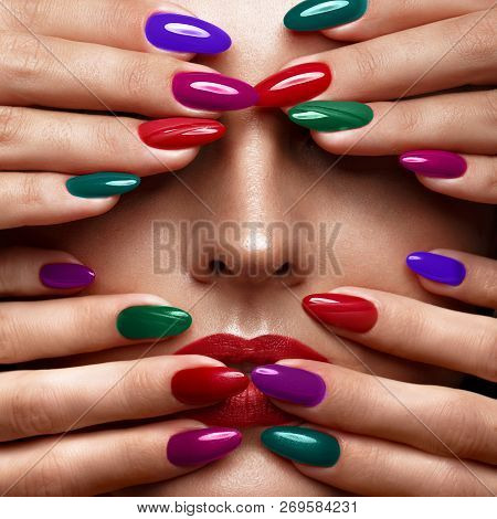 Beautiful Girl With A Classic Make-up And Multi-colored Nails. Manicure Design. Beauty Face.